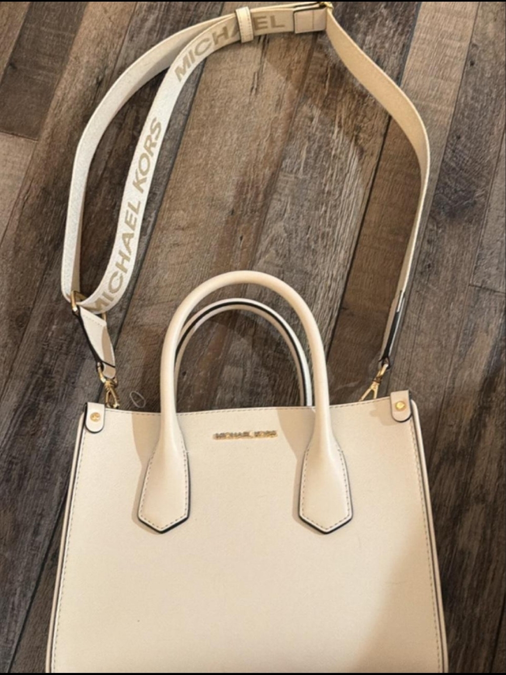 Michael Kors Cream Leather Satchel with Logo Strap.